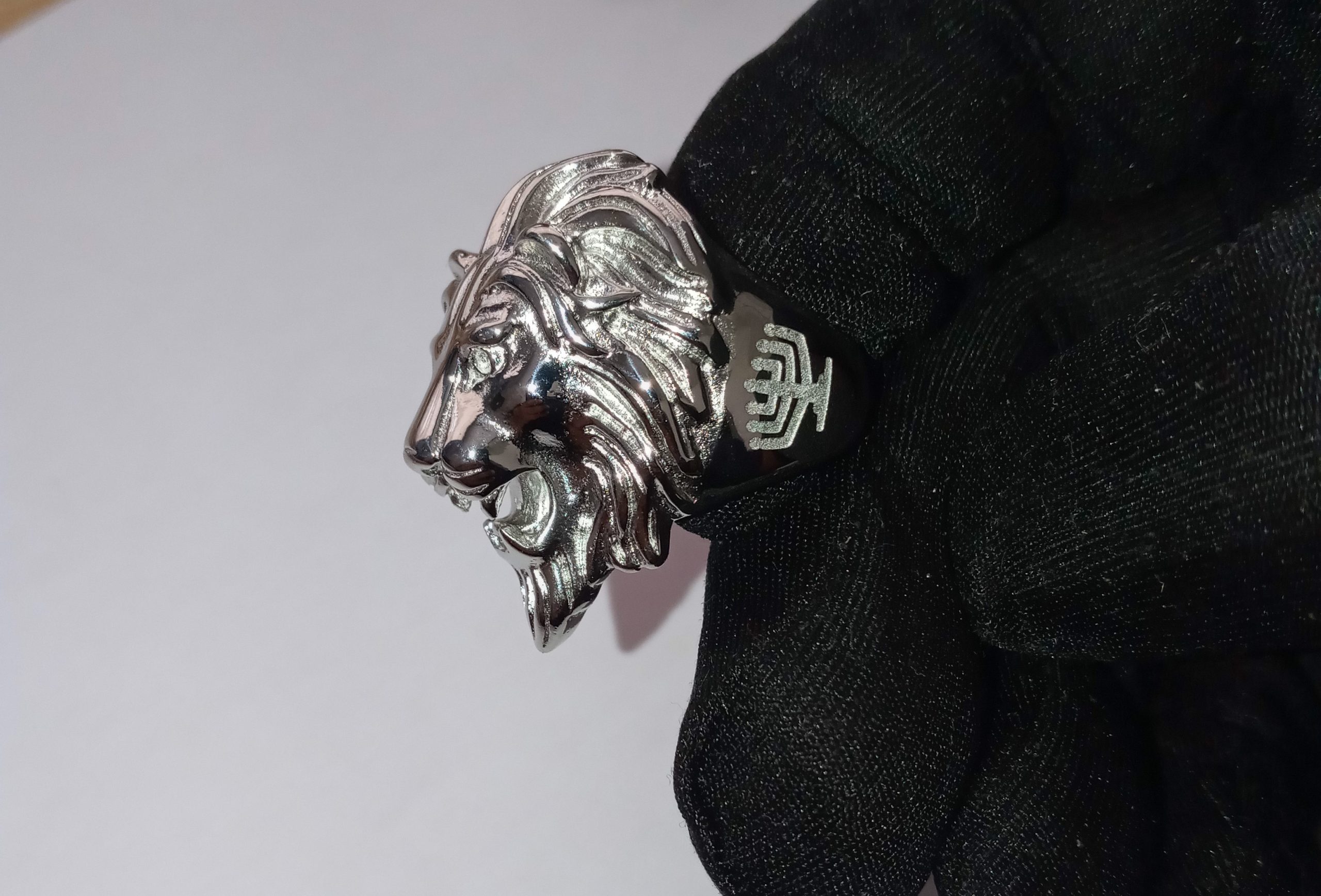 Silver lion ring with menorahs